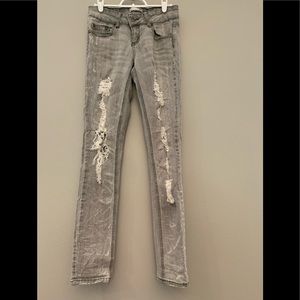 Edgy faded black ripped jeans